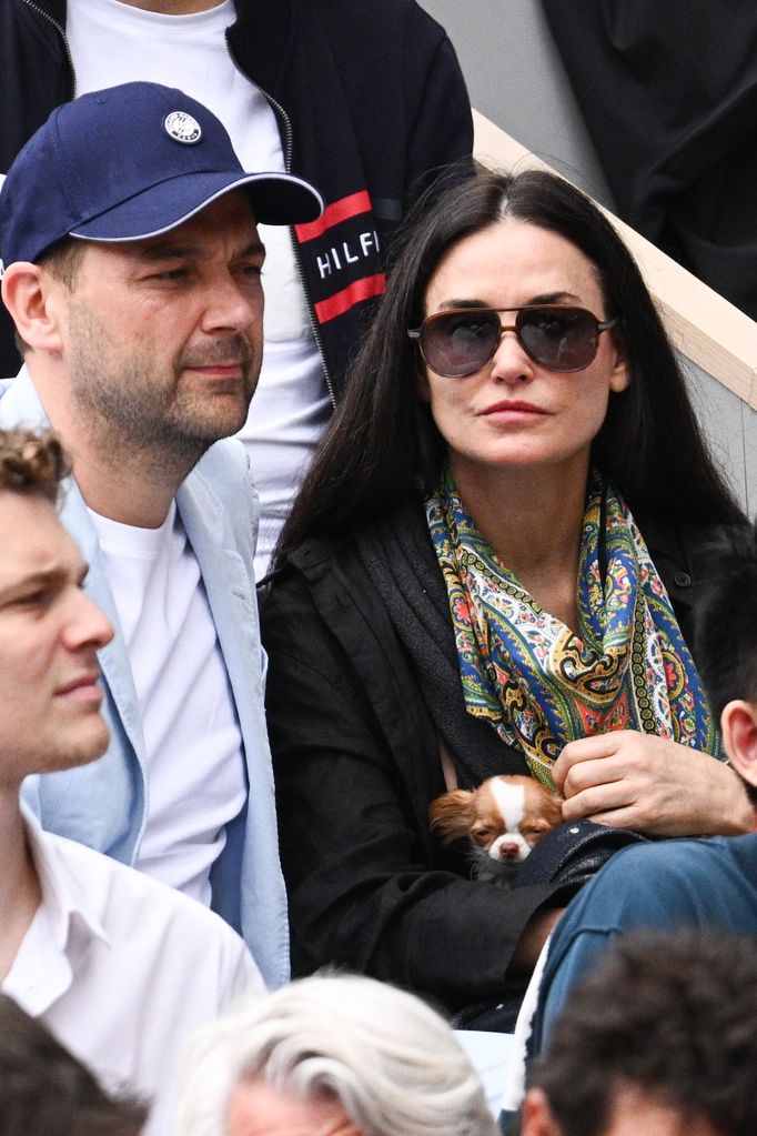 Chef Daniel Humm and Demi Moore with her dog attend the French Open 2022 at Roland Garros on June 05, 2022 in Paris, France