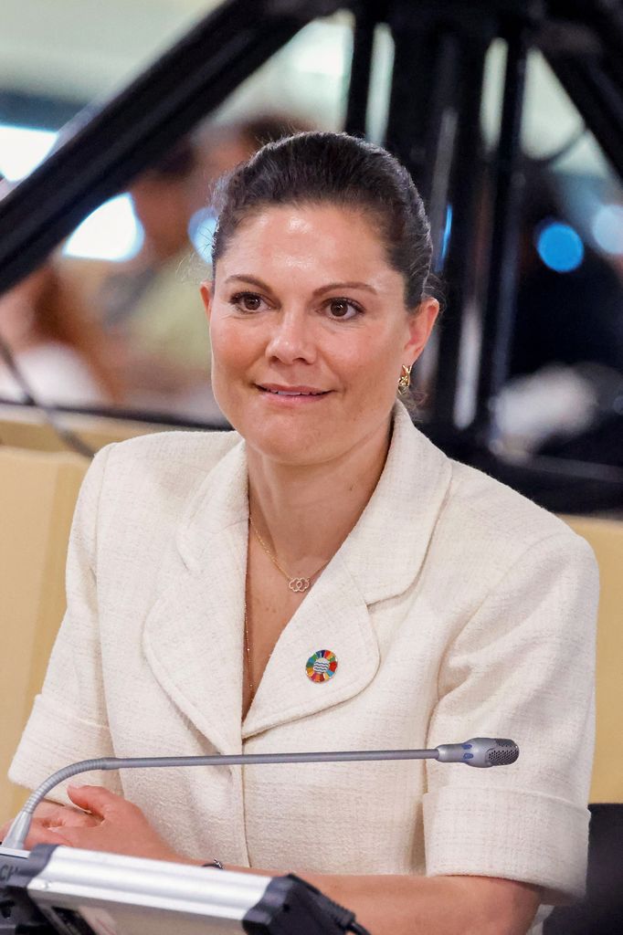Crown Princess Victoria sitting in short sleeve white jacket