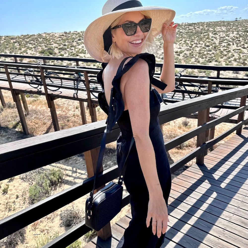 Holly Willoughby wearing a black dress during a holiday in Portugal