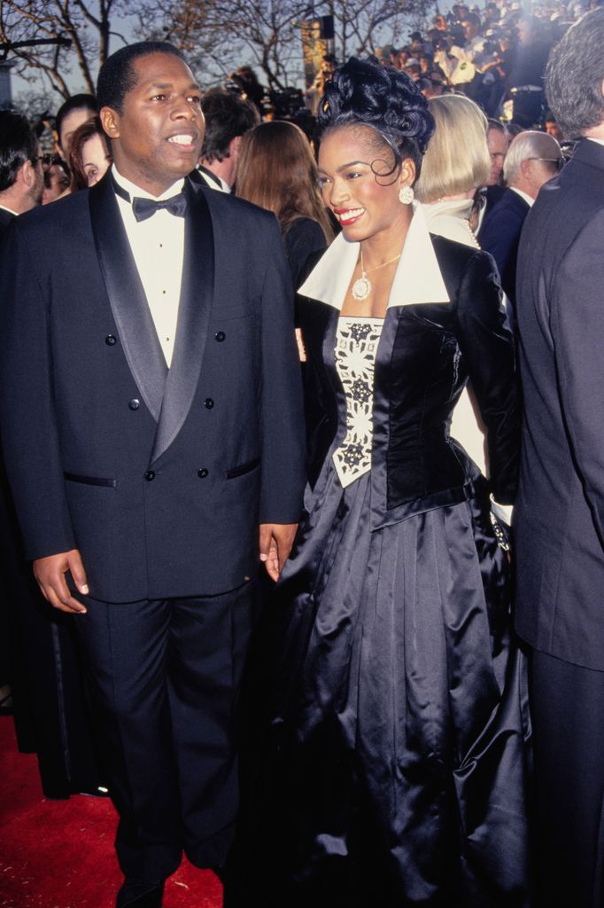 Courtney B. Vance and Angela Bassett attend the 66th Annual Academy Awards held at the Dorothy Chandler Pavilion on March 21, 1994 in Los Angeles, California.