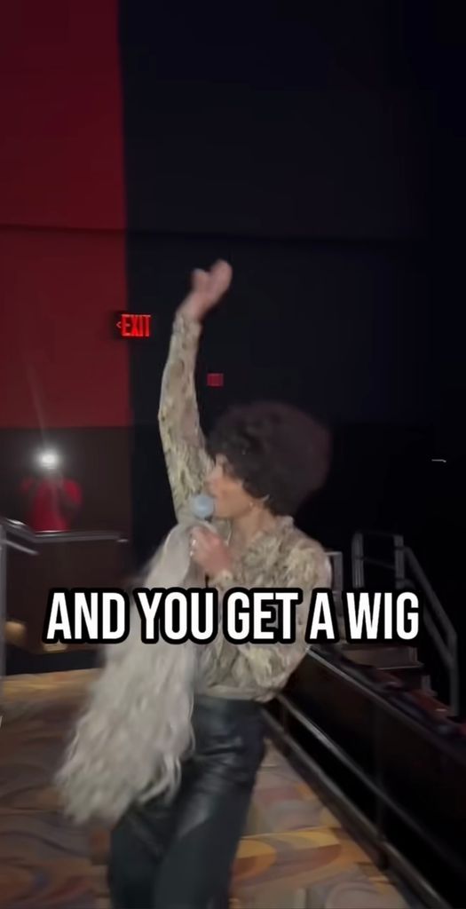 Halle Berry throws wigs to the crowd at a wig screening of her movie "Never Let Go," taken from a video shared on Instagram