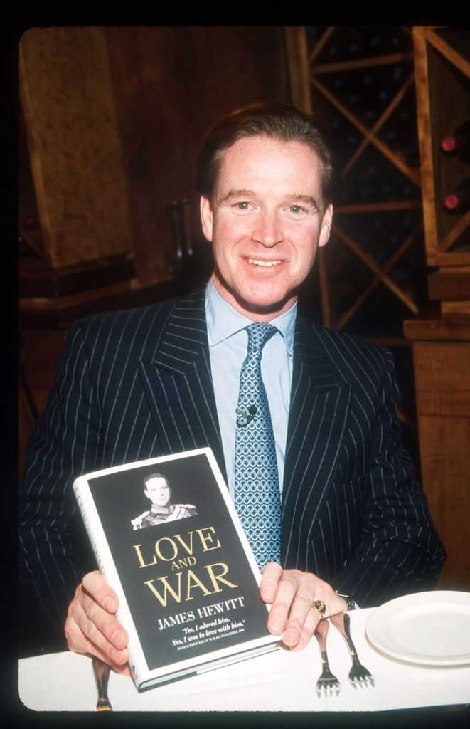 James Hewitt holding his book 'Love and War'