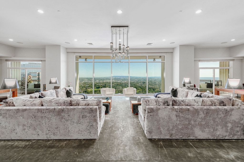 Rihanna has put her luxury LA penthouse at The Century skyscraper - formerly owned by Matthew Perry - back on the market for $25 million just a year after buying it. Pictured: entry living room.
