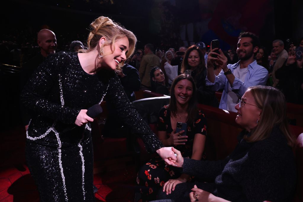 Adele talking to a fan