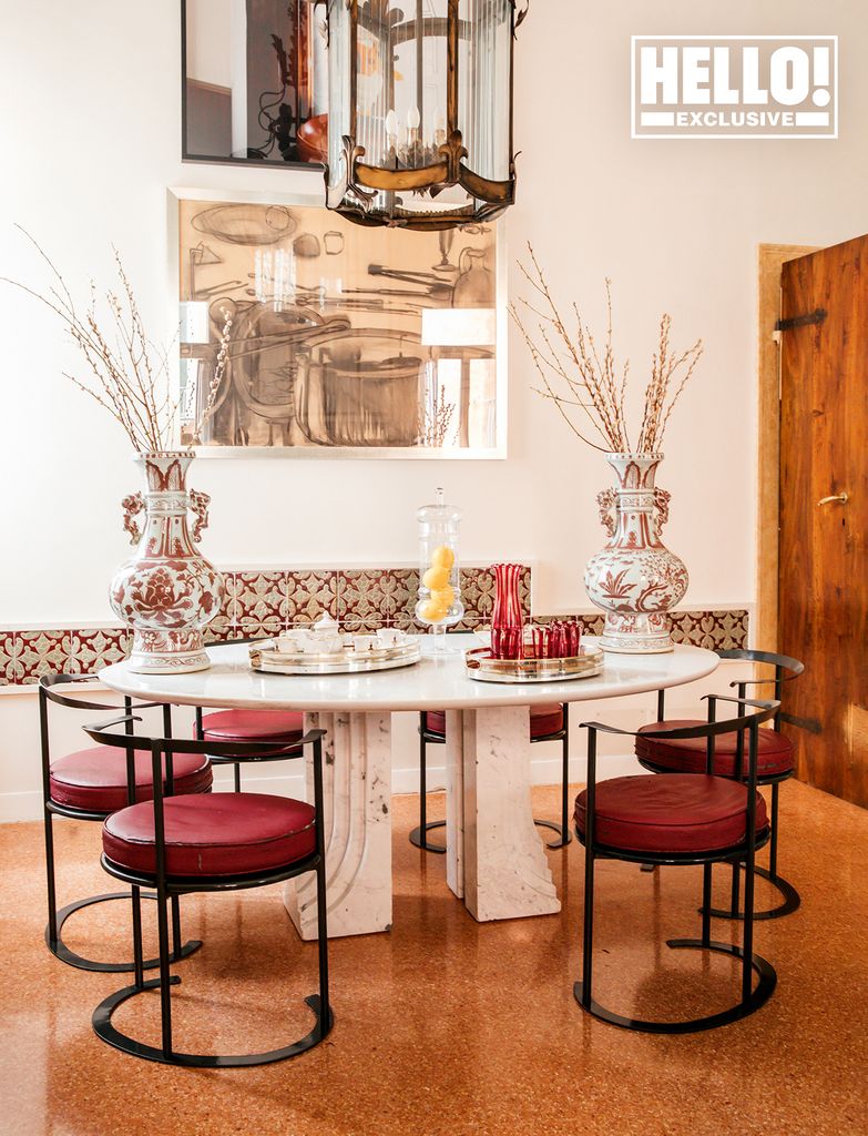 Giovanni and Servane Giol's palazzo in Venice - dining room with marble table and red chairs
