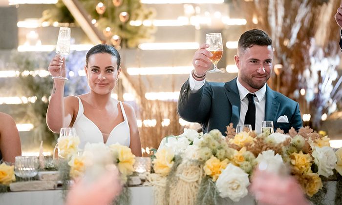 MAFS Bronte and Harrison hold up glasses