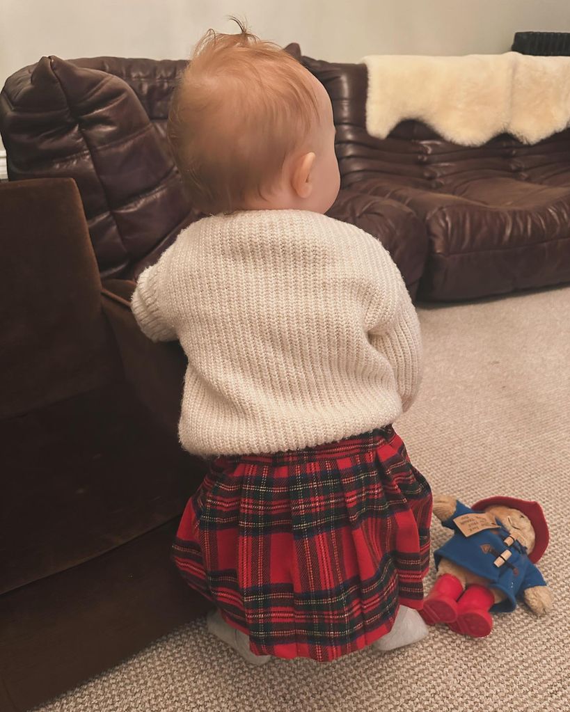 Baby Minnie wearing a tartan skirt 