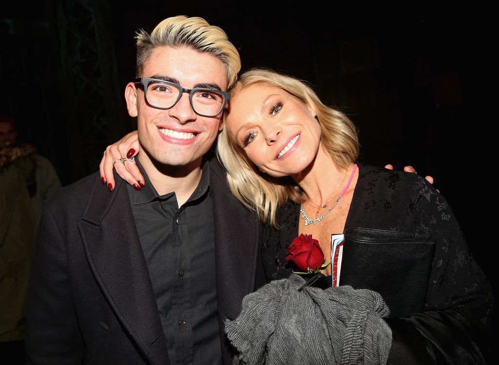 Michael Consuelos and Kelly Ripa pose backstage as Jake Shears of the rock group "The Scissor Sisters" makes his Broadway debut in the hit musical "Kinky Boots" on Broadway at  The Al Hirschfeld Theatre on January 8, 2018 in New York City