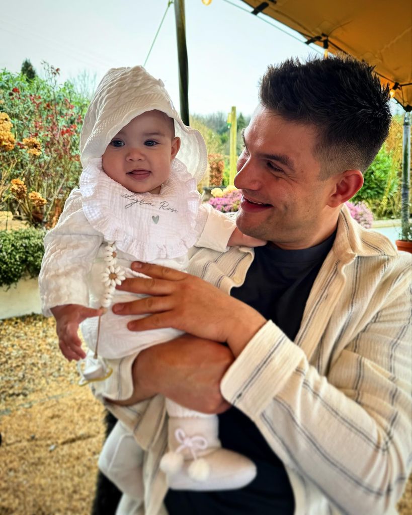 A photo of Aljaz Skorjanec holding his daughter Lrya Rose