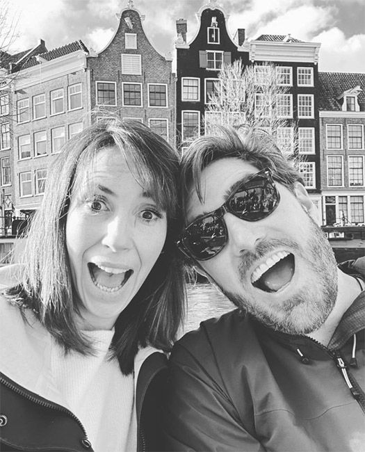 alex jones and her husband pose for photo in Amsterdam