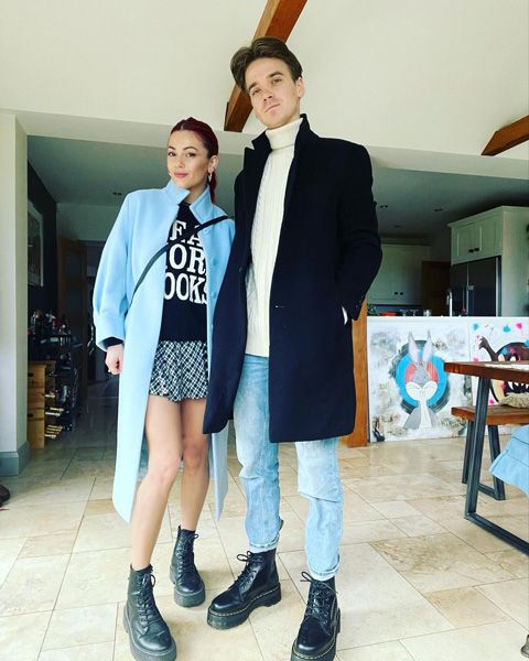 Joe Sugg and Dianne Buswell posing in their home 
