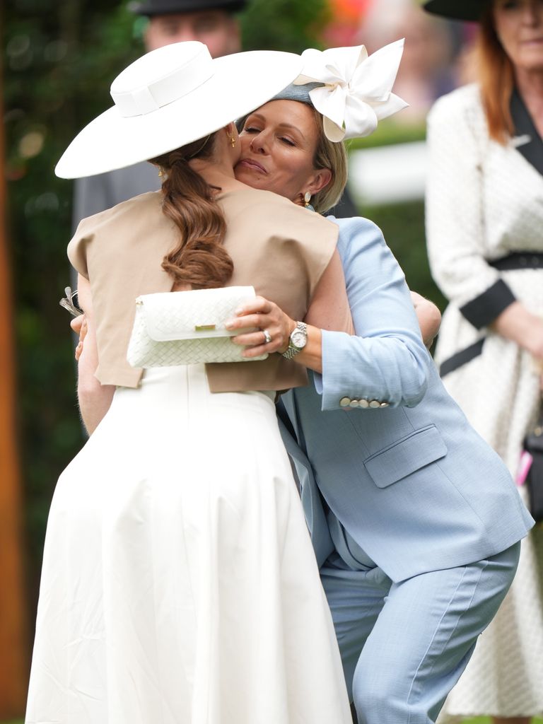Princess Eugenie kissing her cousin Zara Tindall