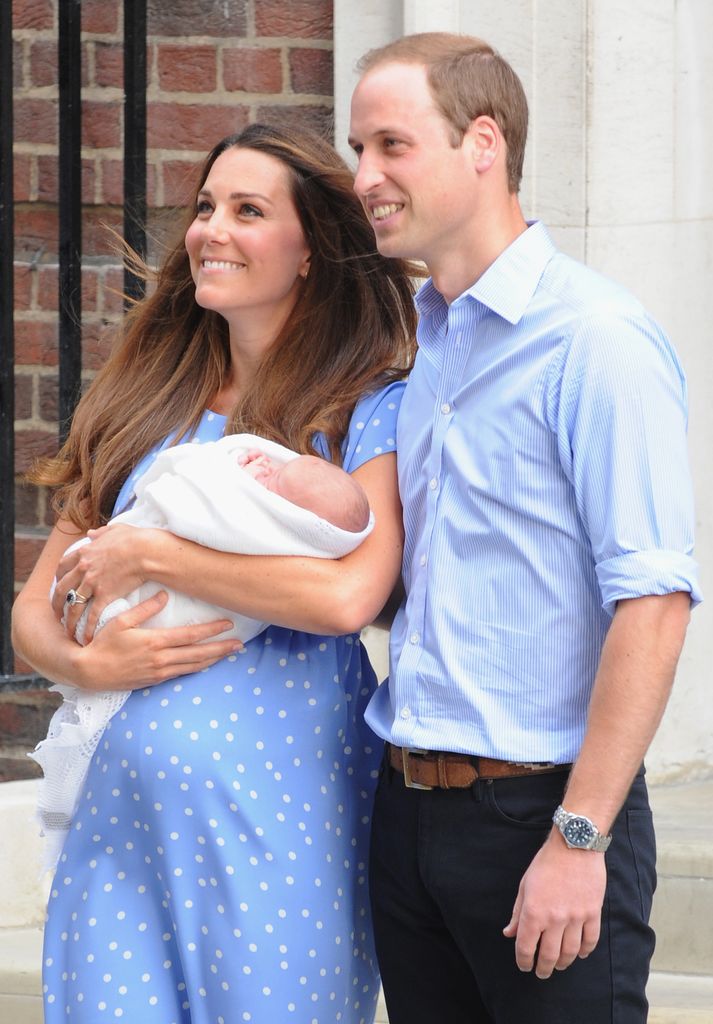 Prince William and Princess Kate carrying a baby Prince George