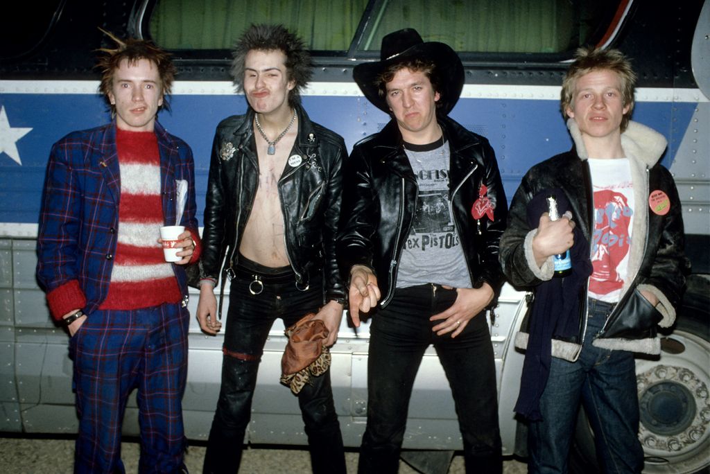 Photo of SEX PISTOLS and Johnny ROTTEN and Sid VICIOUS and Steve JONES and Paul COOK; Group portrait in front of bus during their final tour L-R Johnny Rotten (John Lydon), Sid Vicious, Steve Jones and Paul Cook 