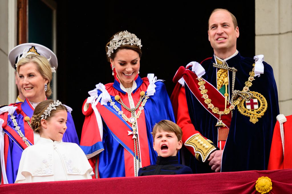 The royal family enjoying a sweet moment on the balcony