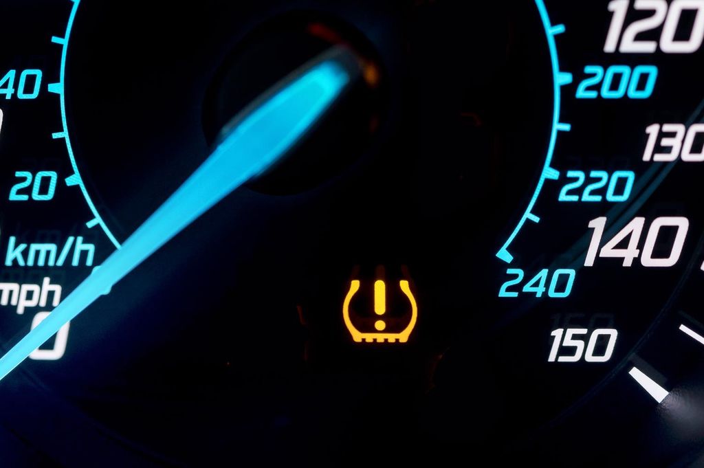 A yellow warning light on the dashboard like this alerts drivers to possible tyre failure