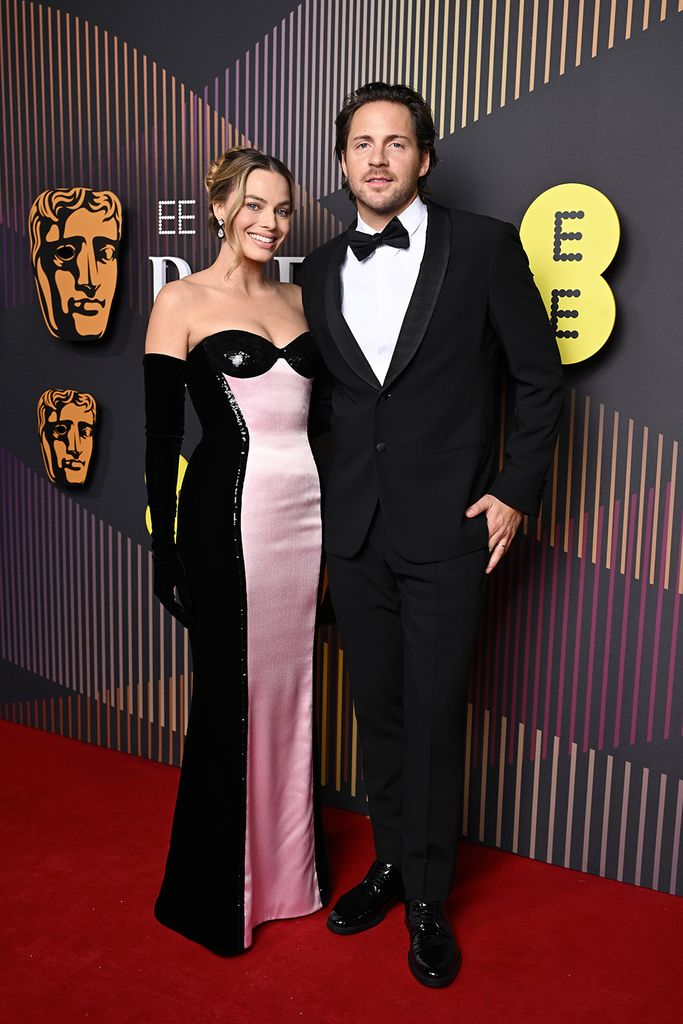 Margot Robbie and Tom Ackerley pose at the 2024 BAFTAs