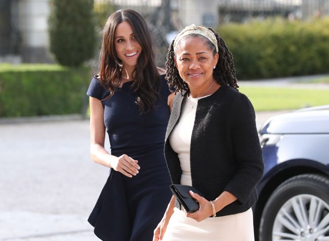 Meghan Markle with her mother Doria Ragland wearing formal clothes exiting a car