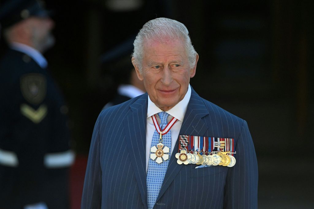 King Charles with medals and a medallion