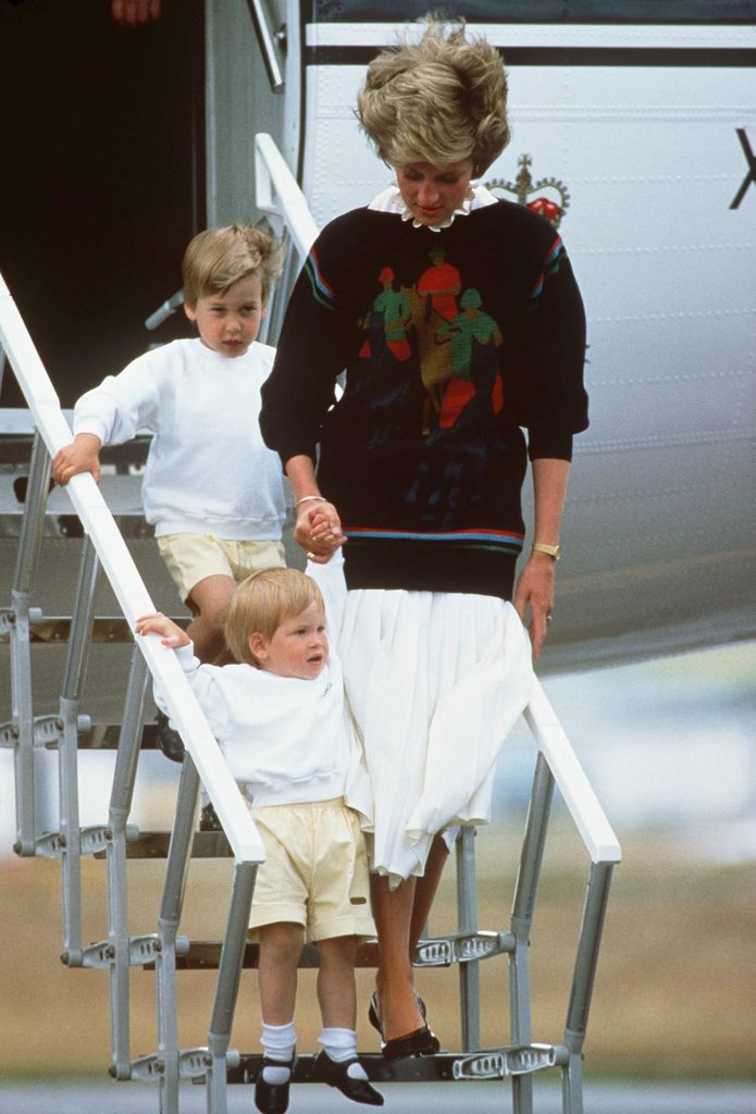 Princess Diana and her two young sons coming off a royal plane