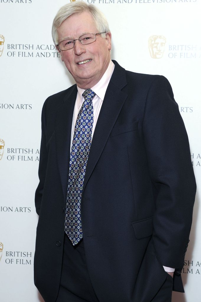 John Craven in a suit and patterned tie