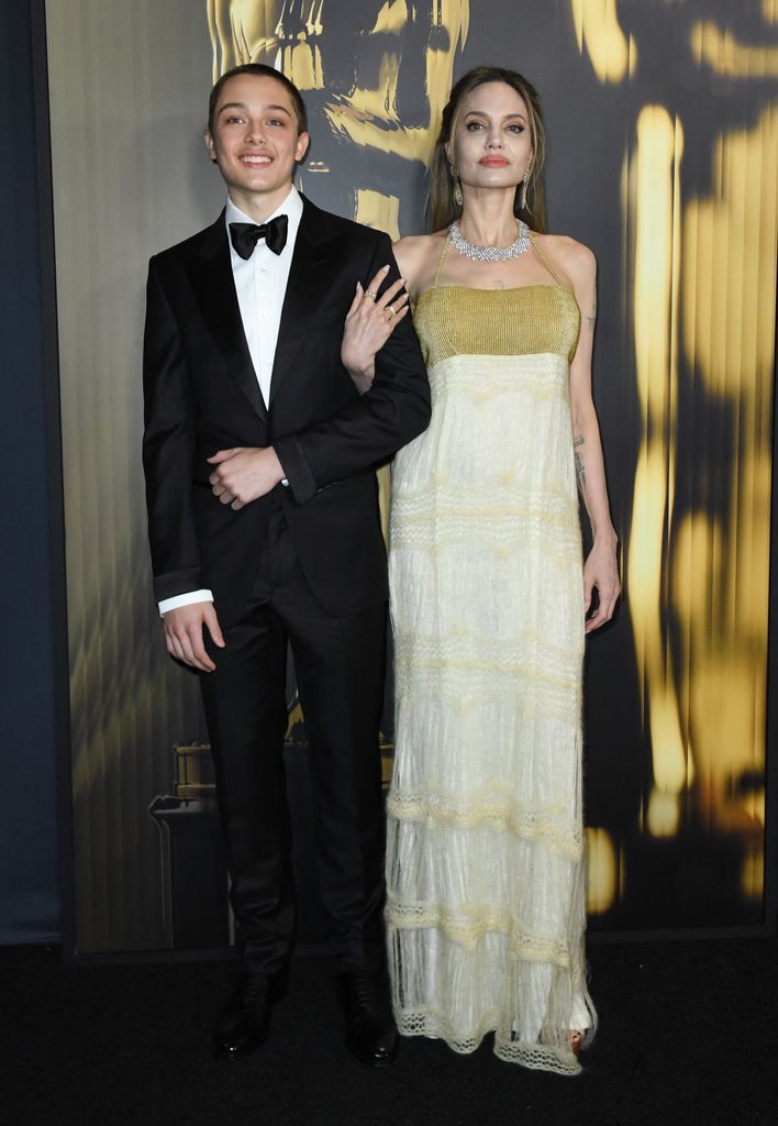 Angelina Jolie and her son Knox Jolie-Pitt arrive for the Academy of Motion Picture Arts and Sciences' 15th Annual Governors Awards at the Ray Dolby Ballroom in Los Angeles on November 17, 2024. (Photo by VALERIE MACON / AFP) (Photo by VALERIE MACON/AFP via Getty Images)