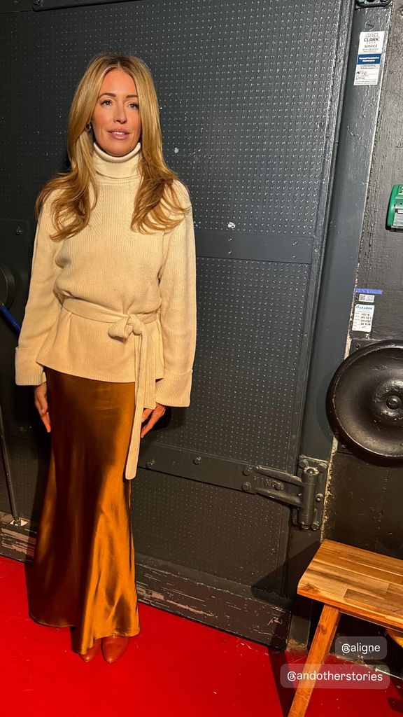 Cat Deeley wearing satin skirt and belted cream jumper