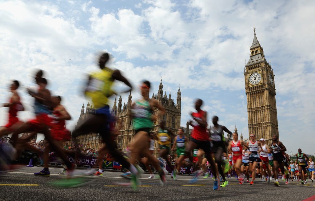 Athletes pass the Palace of Westminster as they compete in the Men's Marathon on Day 16 of the London 2012 Olympic Games on the streets of London on August 12, 2012 in London, England.