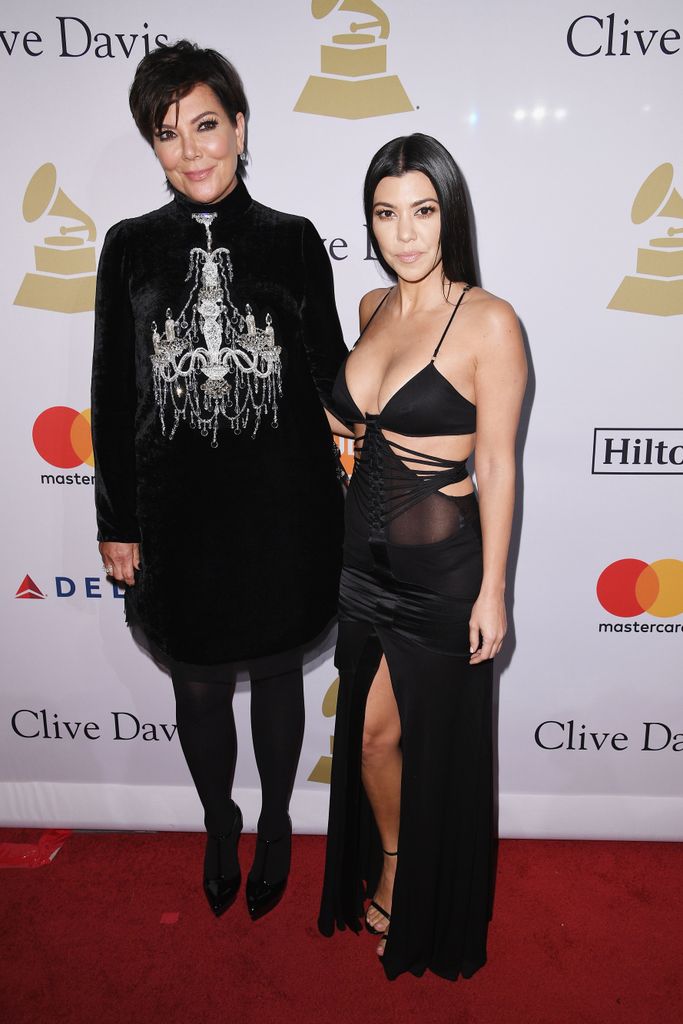 Kris Jenner and Kourtney Kardashian in black clothes on a red carpet