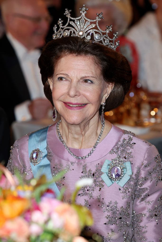 Queen Silvia in a pink dress and tiara