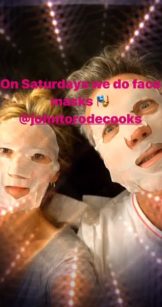 lisa faulkner and john wearing face masks 