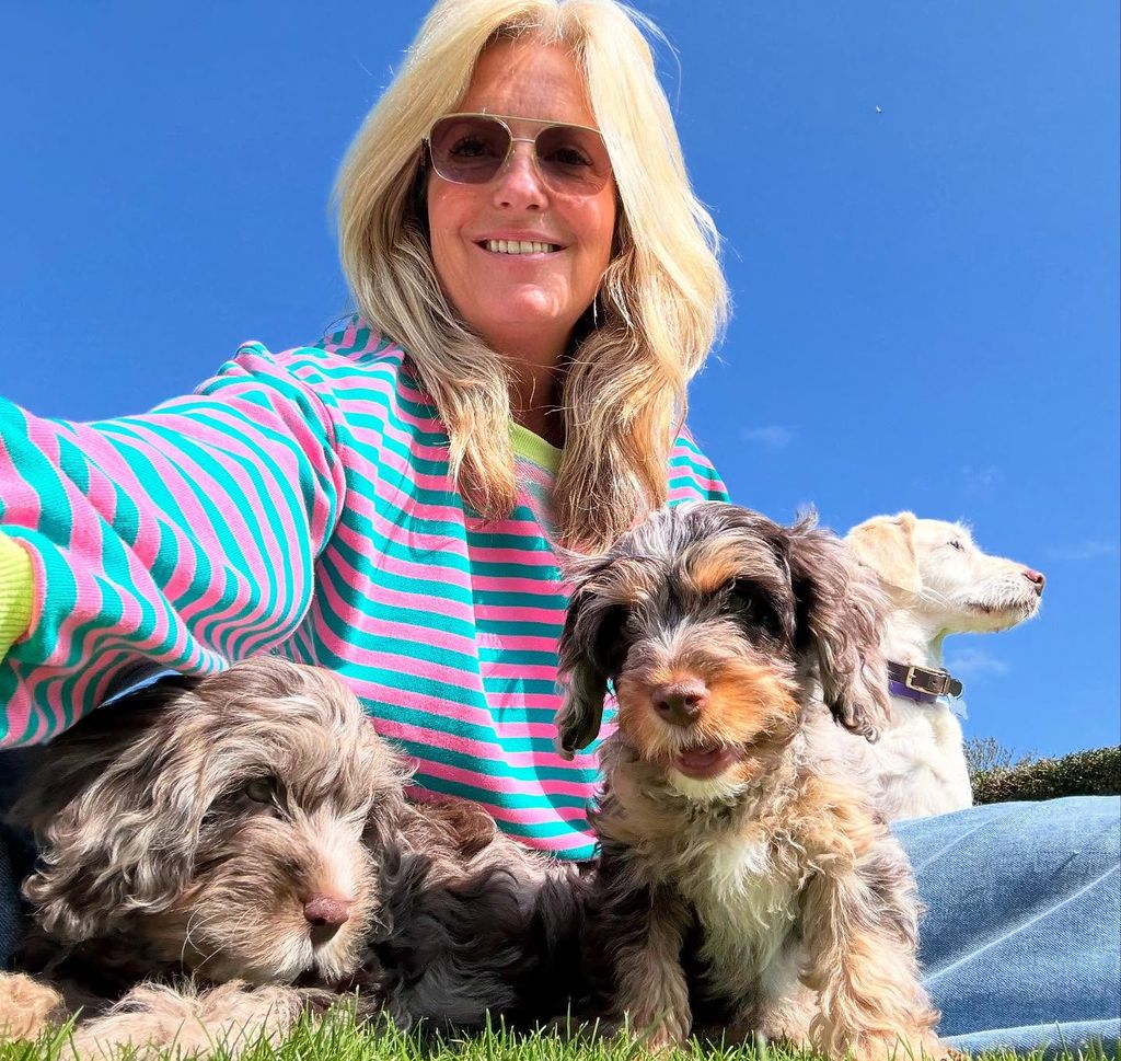 Penny Lancaster with her two new puppies and pet dog Lily 