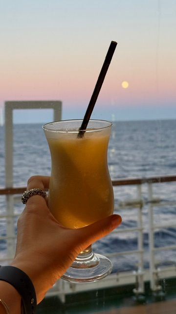 passenger drinking a cocktail aboard P&O cruise ship Azura