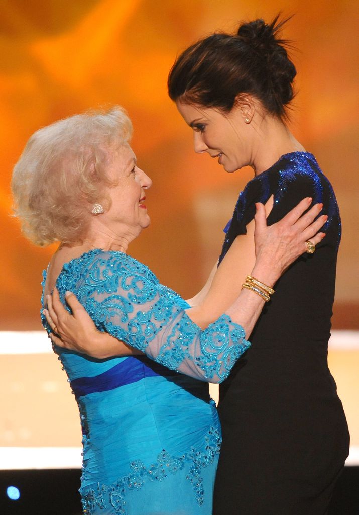 Actress Betty White and presenter Sandra Bullock onstage at the TNT/TBS broadcast of the 16th Annual Screen Actors Guild Awards held at the Shrine Auditorium on January 23, 2010 in Los Angeles, California.