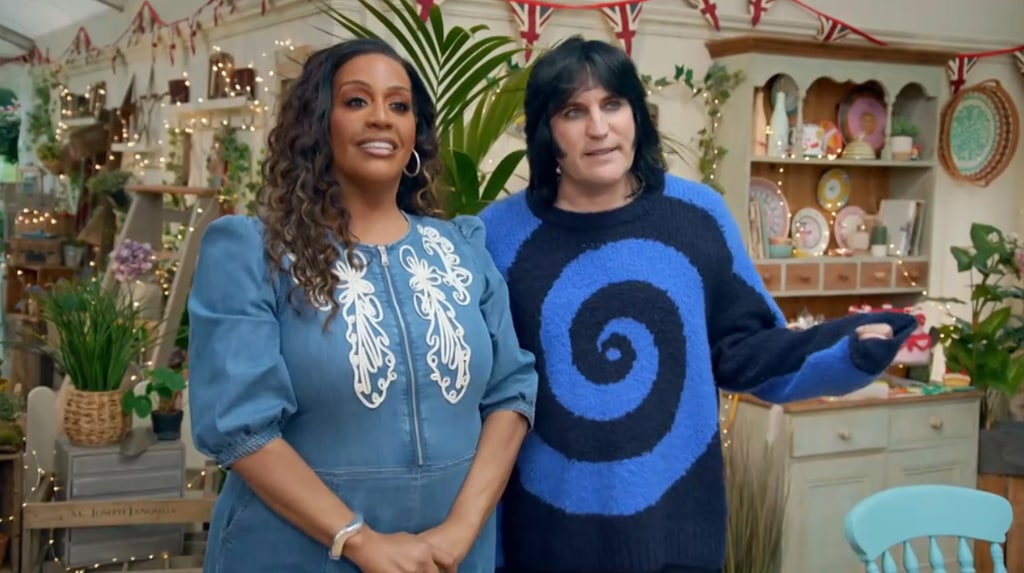 two presenters standing in front of cabinet of plates and fairy lights