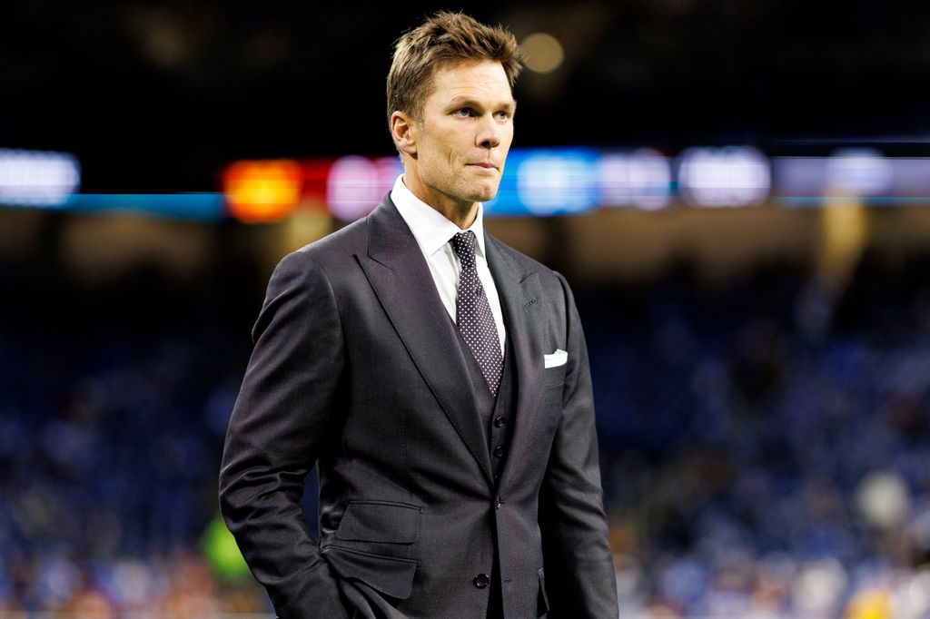 Fox Sports commentator Tom Brady stands on the field prior to the NFC Divisional Playoff game between the Washington Commanders and the Detroit Lions, at Ford Field on January 18, 2025 in Detroit, Michigan