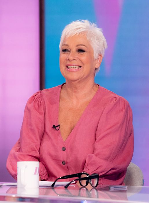 Denise Welch smiling in a pink blouse
