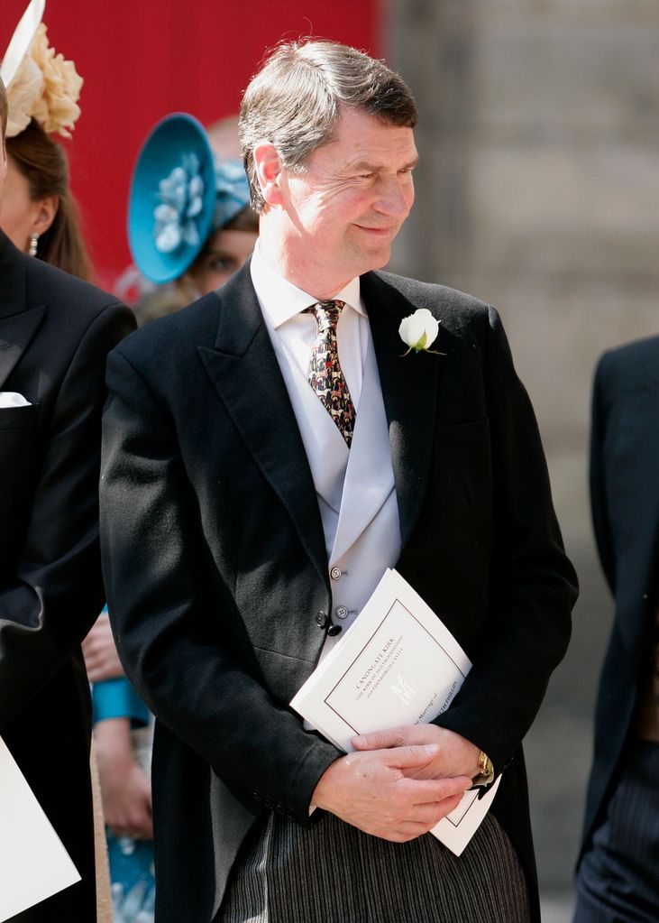 Tim Laurence smiling in a suit at Zara and Mike's nuptials