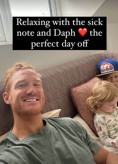 Greg Rutherford on a sofa with two children