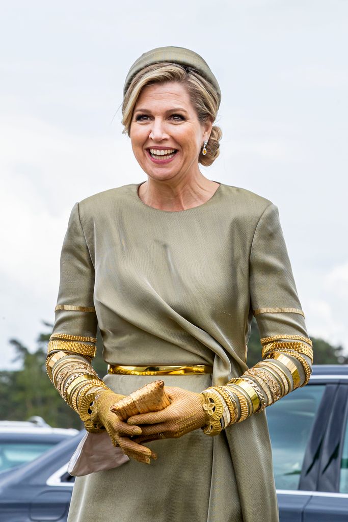 queen maxima in olive dress and headband