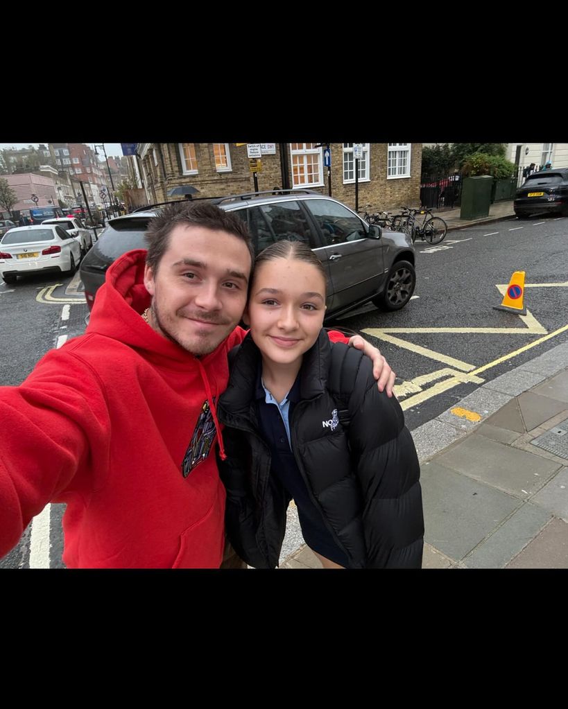 Brooklyn and harper beckham selfie on street