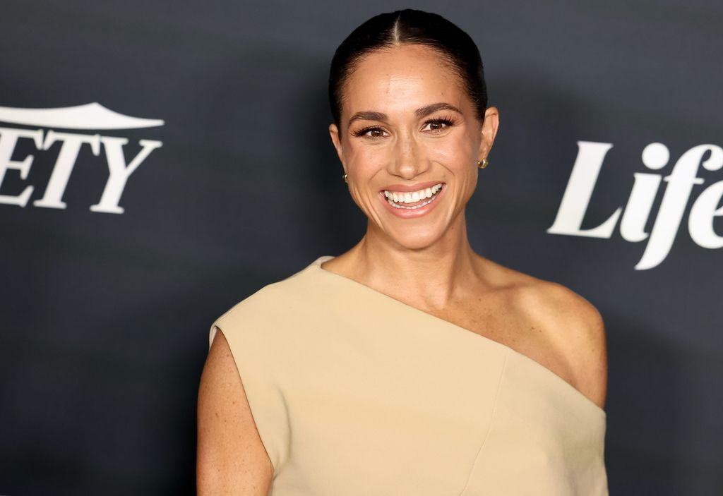Meghan Markle in a tan dress