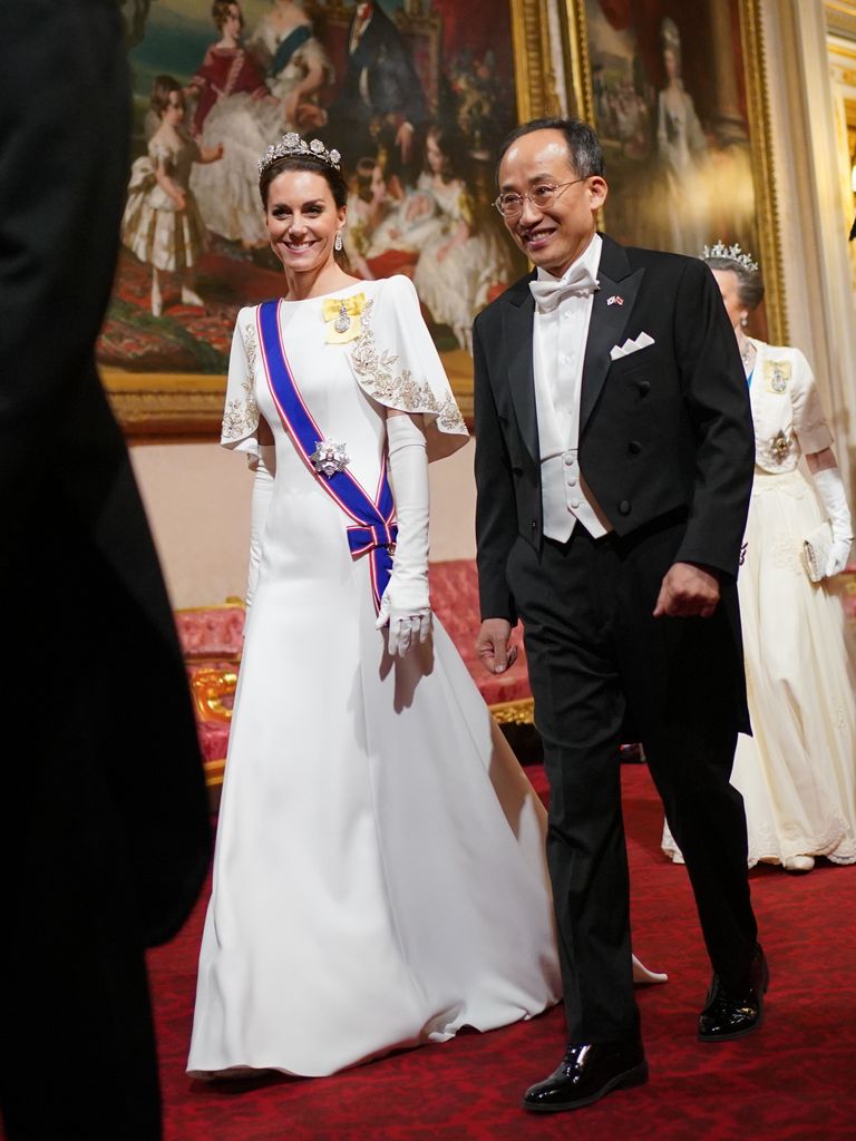 The Princess of Wales and Choo Kyung-ho walk through halls of palace