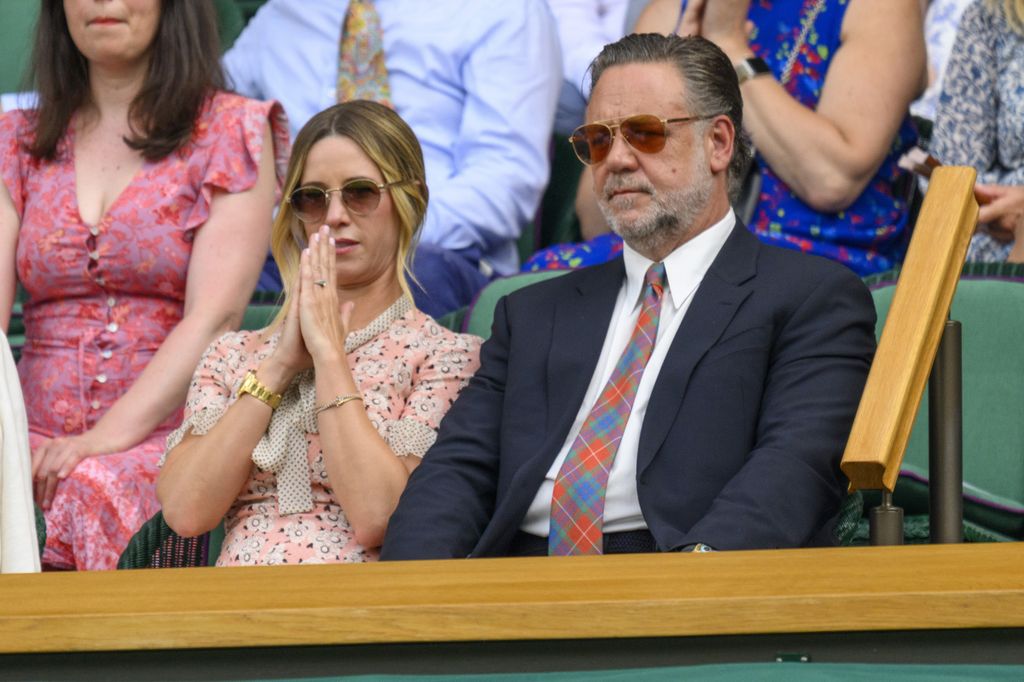 Actor Russell Crowe and Ms Britney Theriot watch tennis from the Royal Box during the second day of the 2024 Wimbledon Championships 