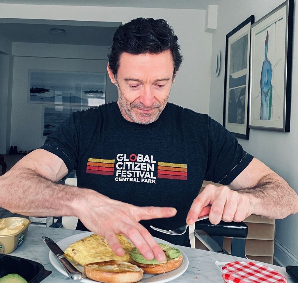 Hugh Jackman eating in his home