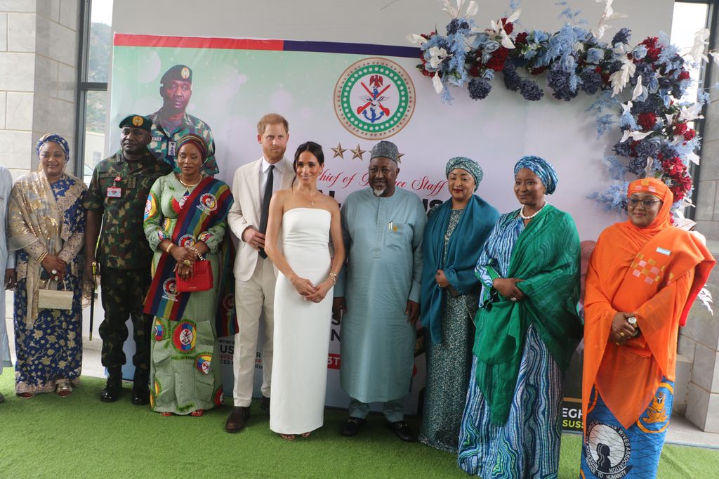 Harry and Meghan pose for a photo with Nigeria's Chief of General Staff General Christopher Gwabin Musa and other participants
