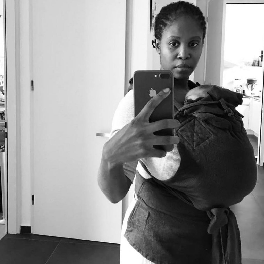 Motsi Mabuse with her baby in sling