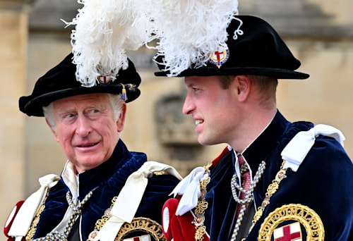 King Charles and Prince William in feathered caps
