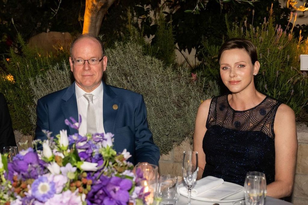 Princess Charlene and Prince Albert sitting at dinner