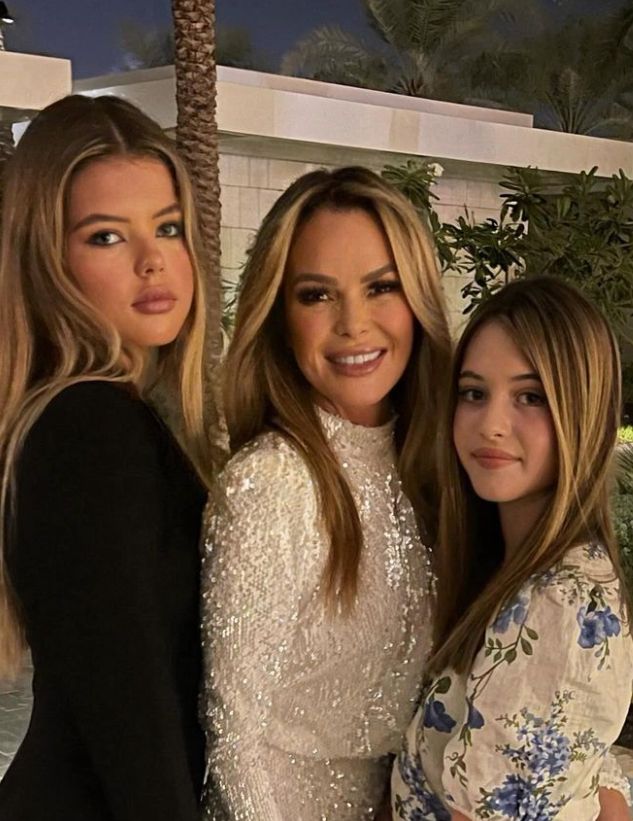 Amanda Holden posing with her two daughters